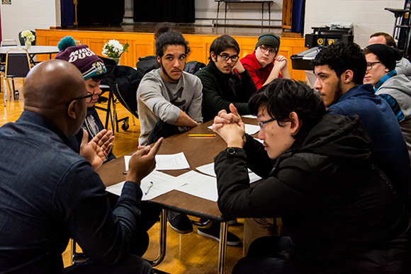 A group of Pathways students in Ann Arbor gather in discussion.