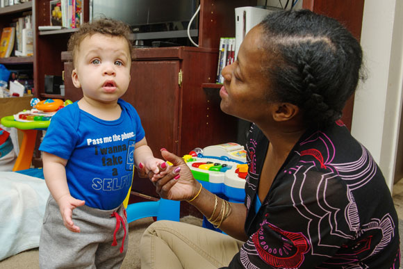 WISD home visitor, Althea Wilson, works with a toddler.