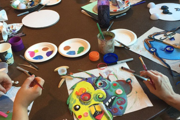 Participants making masks out of trash.