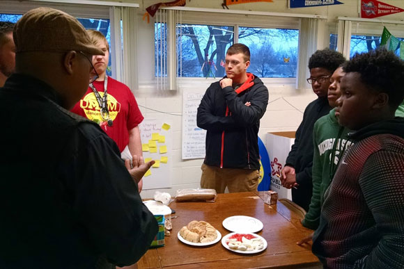 EMU Bright Futures students and instructors share a potluck together.