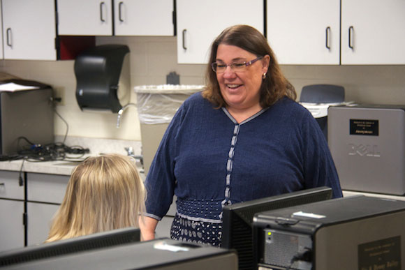 Angela Reed, superintendent and principal at DeTour Area Schools, consults with a teacher.