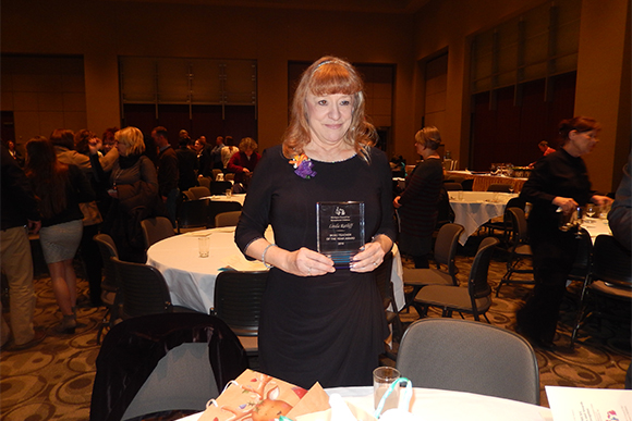 Linda Ratliff with her Teacher of the Year award from the Michigan Council for Exceptional Children. 