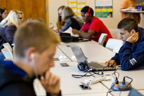 Chris Scott, 17, of Port Huron, works on his laptop Wednesday at the Virtual Learning Academy in Port Huron Township.