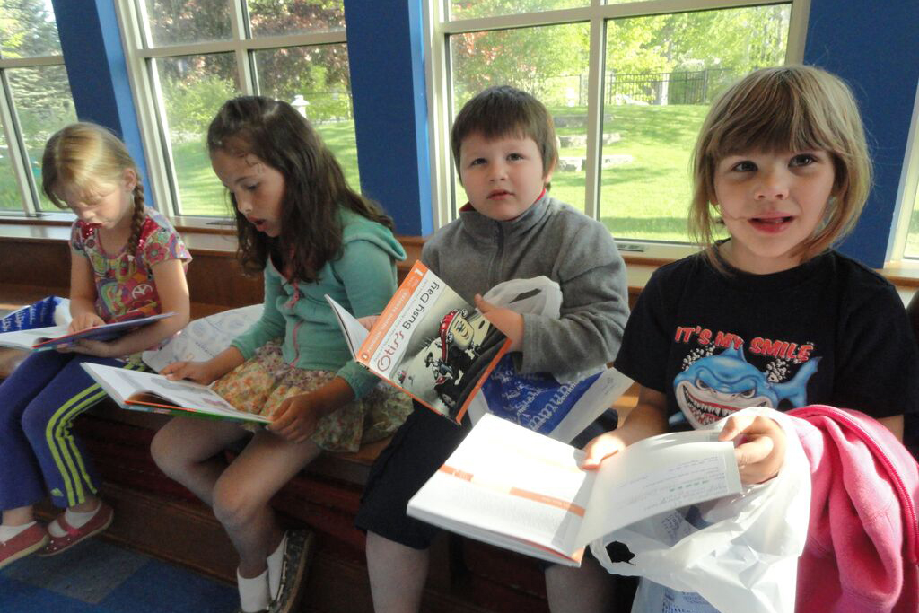 Children at the Charlevoix Library earn their next grade level appropriate book.