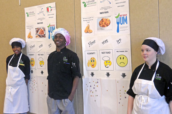 Left to right: Lanesha Spencer (Muskegon), Alvin Kirkland (Muskegon Heights) and Tabitha Looman (Fruitport) assisted elementary students with rating the dishes they tasted.