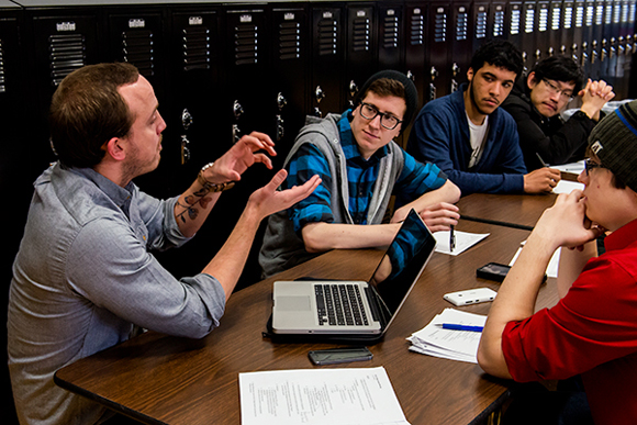 A group of Pathways students in Ann Arbor gather in discussion.