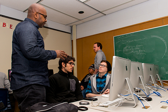 Tyrone Weeks engages with Pathways to Success students in Ann Arbor.