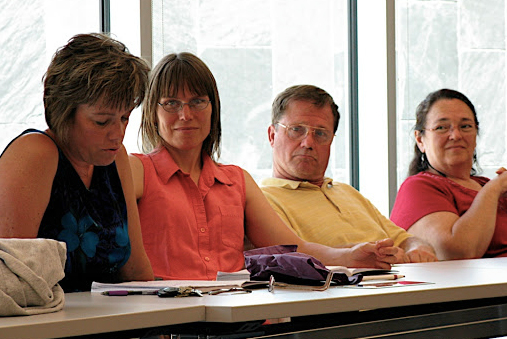 Teachers listen during a CRWP session.