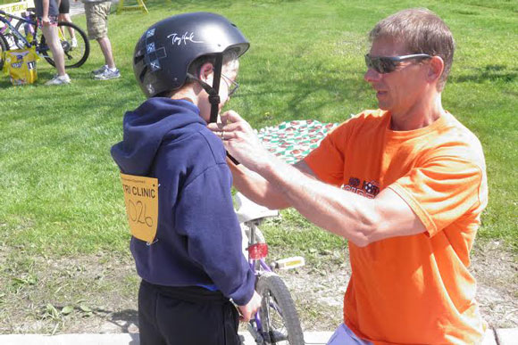 No More Sidelines participant remembers safety first and gets helmeted up before  the big race. 