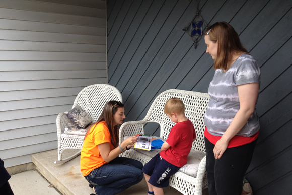 Amanda Harris of Sycamore Elementary visits with a kindergarten family in their home before the first day of school.
