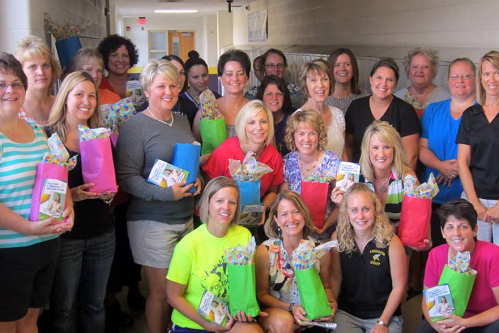 Teachers receive their professional development gift bags.