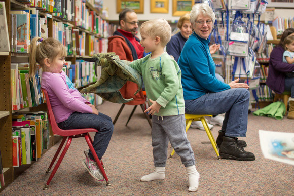 Children play during story time at the Muskegon Area District Library.