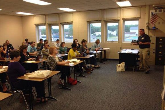 Teachers take a seat in the classroom during a Boyne Tech Conference breakout session.