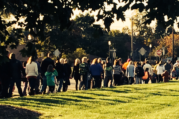A group of students and teachers walked to Potter Elementary School in Flint from a local church on Walk to School Day 2014.
