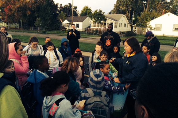 Pine Knob students and parents walked to school in a walking parade along Sashabaw Road in Clarkston on Walk to School Day 2014.