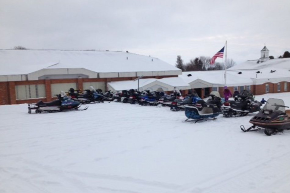 Snowmobiles parked outside the Mackinac Island Public School in February.