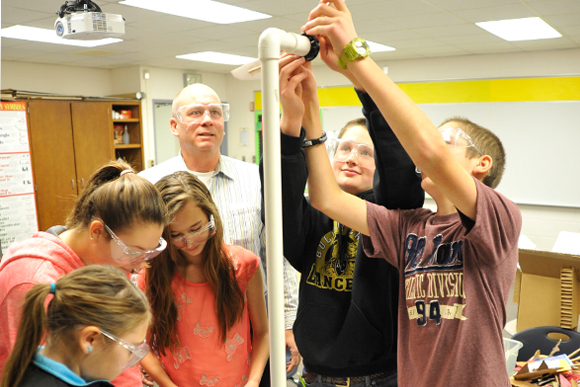 Kaylee Monville, Faith Johnson, Kalli Emeott, teacher David Brown, Zachary West, and Austin West build a wind turbine at Bullock Creek Middle School.