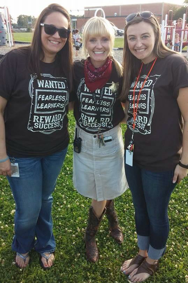 (Left to right) Lindsey Harris, reading interventionist; Melissa Usiak, principal and Amanda Harris, kindergarten teacher at Sycamore Elementary, stop for a quick pic while canvassing.