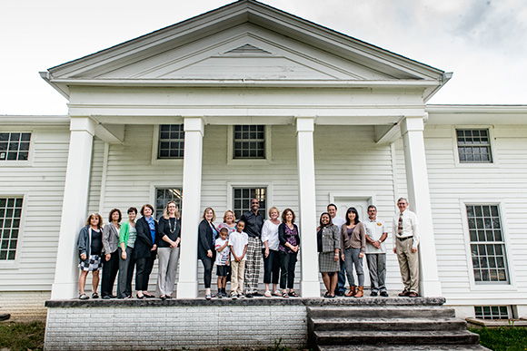 Dr Benjamin Edmondson with the staff at the YCS offices